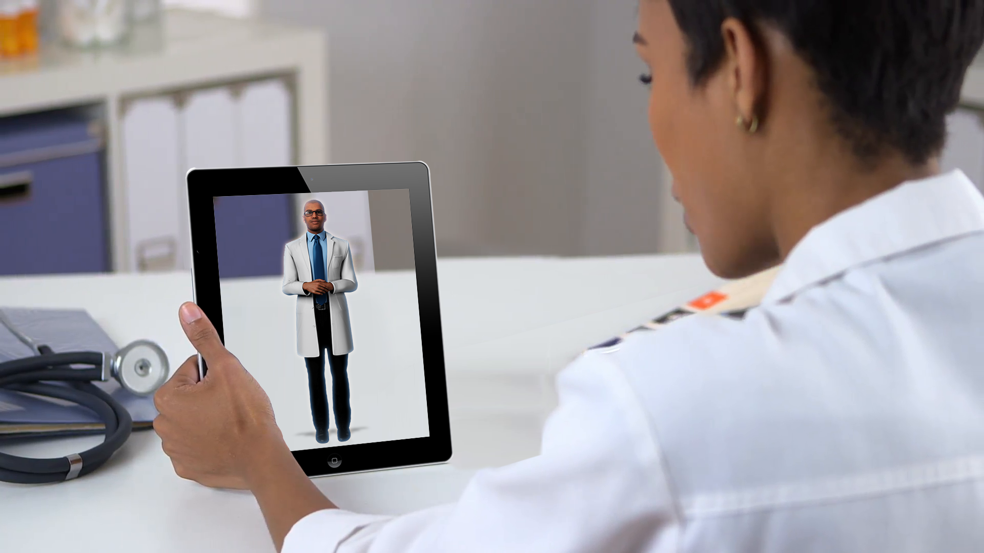 man holding an ipad with a prsonas hologram being shown in augmented reality