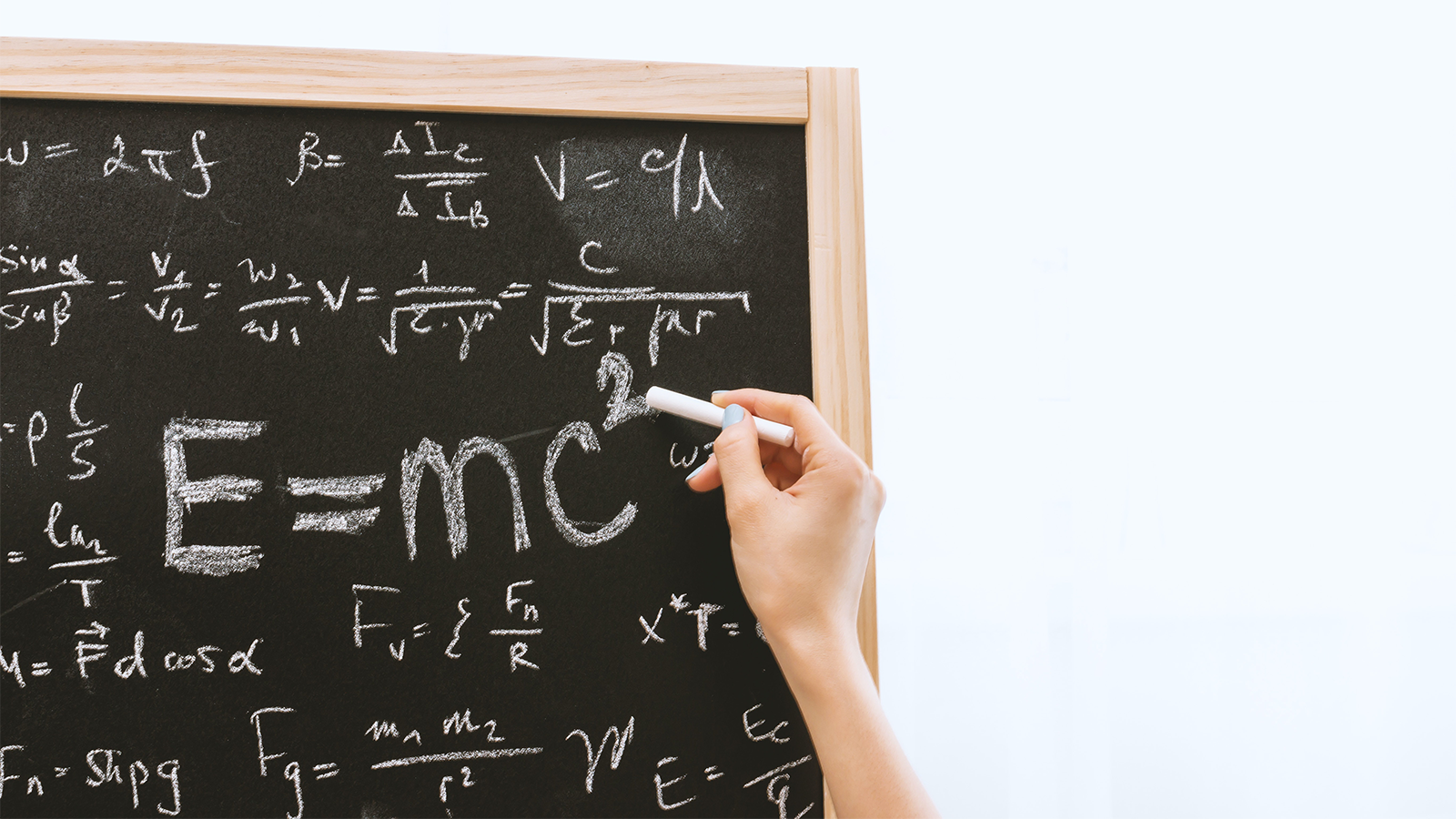 black board equation showing Einstein's question e=mc²